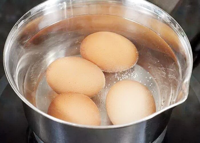 How can I hard boil eggs without the shells cracking